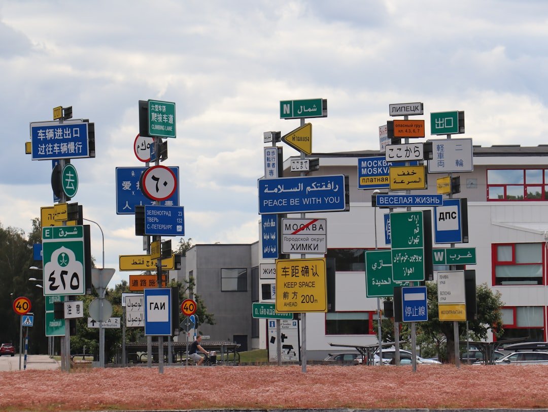 Colorful highway road signs showing various letters and destinations